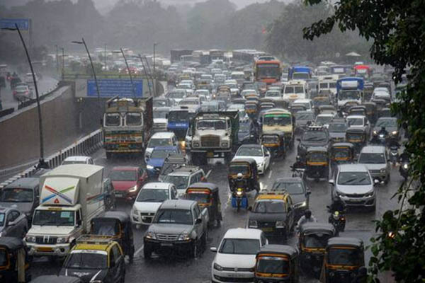 Torrential rainfall paralyses Mumbai; streets, rail tracks flooded as IMD issues red alert (PICS)