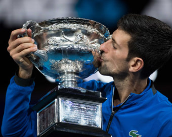 MELBOURNE: Novak Djokovic of Serbia kisses the trophy during the trophy awarding ceremony after the men
