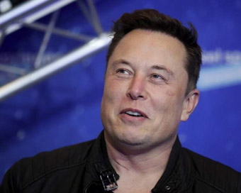 As takeover fires Twitter stock, Elon Musk turns mushy and cute
