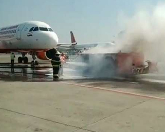 Major tragedy averted at Mumbai airport as vehicle towing Air India plane catches fire