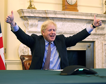 Johnson tweeted a picture of himself smiling with both thumbs lifted in the air.