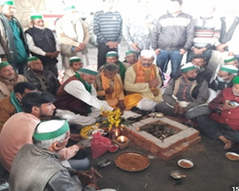 Farmers perform puja