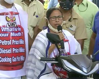Mamata Banerjee rides e-scooter to protest petrol price hike