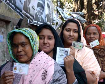 DHAKA : Voters line up at a polling station in Dhaka, Bangladesh, Dec. 30, 2018. Nationwide voting opened Sunday morning in Bangladesh