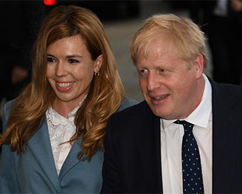Boris Johnson with partner Carrie Symonds (file pic)