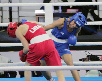 New Delhi: Indian boxer Manisha Moun and USA boxer Christina Cruz in action during the 10th AIBA Women