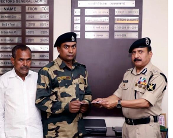 Mohammad Aness handed over a cheque of Rs 10 lakh by BSF