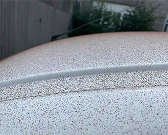 A car bonet covered with cocoa flakes