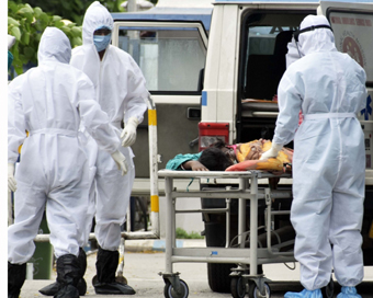 Kolkata: Health workers wearing Personal Protective Equipment (PPE) suit take a suspected COVID-19 patient to be admitted at a hospital in Kolkata during the extended nationwide lockdown imposed to mitigate the spread of coronavirus; on Apr 19, 2020.