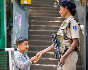 Adorable photo of Kashmiri child shaking hands with CRPF personnel wins hearts