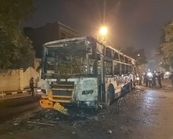 New Delhi: The charred remains of a bus that was set ablaze by unknown miscreants during a protest against the Citizenship (Amendment) Act, 2019 and National Register of Citizens (NRC) in New Delhi on Dec 15, 2019. (Photo: IANS)