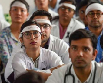 Unpaid protesting Delhi doctors threatened with termination notice