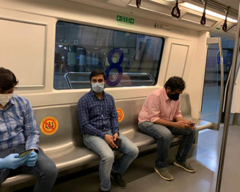 People travelling in Delhi Metro