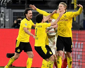 Haaland brace takes Dortmund to Champions League quarters