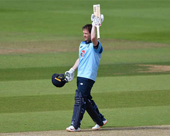 Captain Eoin Morgan raises his bat after scoring a ton