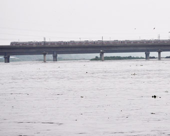 New Delhi: A view of a over flowing  water level in Yamuna river in New Delhi on Saturday, July 28, 2018. The water level in Yamuna river increased after 1.31 lakh  cusec water was released from Hathnikund Barrage due to heavy rainfall in the hills.