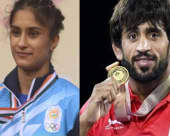 Wrestlers Punia, Phogat slam Haryana