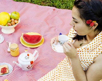 A girl eating food outdoor