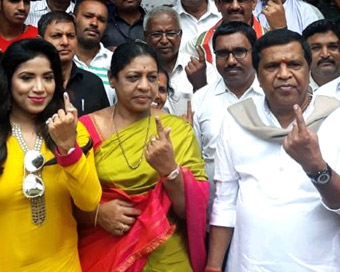 Mandya: Congress-JD-S coalition candidate for Mandya, Shivarame Gowda shows his finger marked with phosphoric ink after casting his vote during Karnataka by polls in Mandya on Nov 3, 2018. The by-polls are being held in Bellary (reserved), Mandya and