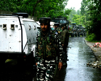  Security personnel deployed at the site where a gunfight broke out between militants and security forces in Jammu and Kashmir