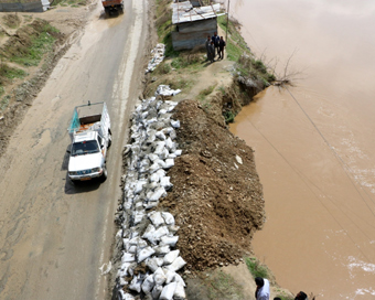 Pampore: Jhelum water erodes Srinagar-Jammu national highway at Galander Pampore in Jammu and Kashmir on April 7. 2017. (Photo: IANS)