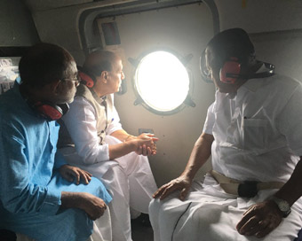 Kerala: Union Home Minister Rajnath Singh along with Kerala Chief Minister Pinarayi Vijayan and Union Culture and Tourism Minister Alphons Kannanthanam, conducting the aerial survey of flood affected areas in Kerala.