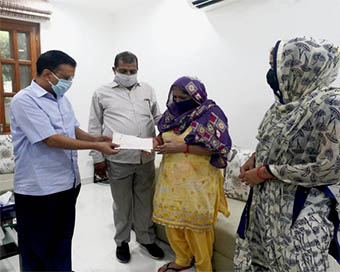 Delhi Chief Minister Arvind Kejriwal meets deceased firefighter