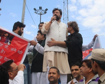 Jammu: Former Jammu and Kashmir Minister Choudhary Lal Singh addresses during a protest march organised to press for a CBI probe in the Kathua rape and murder case; in Jammu on April 17, 2018. Singh stepped down as the Forest Minister along with Chan