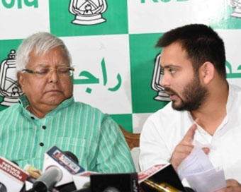 Tejashwi with Lalu (file photo)