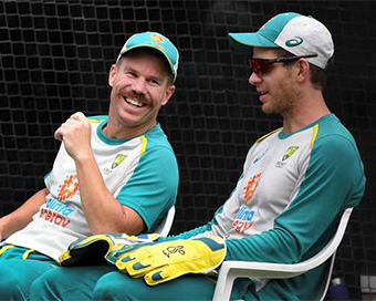 Warner sharing a laugh with coach Langer