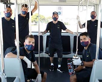 Messi poses in mask with Barca teammates 