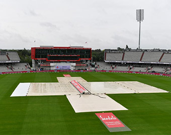 Rain dealys play at Old Trafford, Manchester
