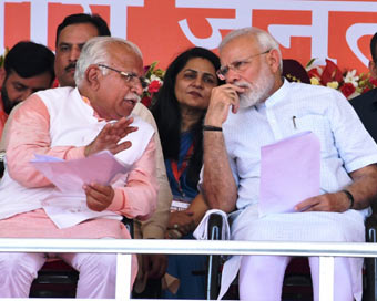 Rohtak: Prime Minister Narendra Modi interacts with Haryana Chief Minister Manohar Lal Khattar during a rally ahead of the upcoming Haryana Assembly Elections in Rohtak, Haryana on Sep 8, 2019. (Photo: IANS)