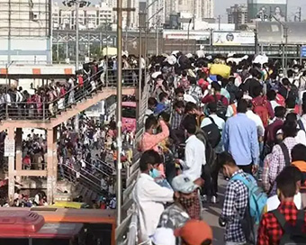 Delhi Lockdown: Migrants queue up at bus stands to rush home