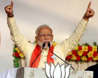 West Bengal, May 16 (ANI): Prime Minister Narendra Modi addresses during an election meeting at Mathurapur in West Bengal on Thursday. (ANI Photo)