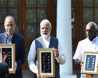 New Delhi: Prime Minister Narendra Modi interacts with visually impaired children during the release of new series of visually impaired friendly circulation coins, in New Delhi, on March 7, 2019. Also seen Union Finance Minister Arun Jaitley and Unio