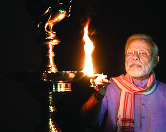 Prime Minister Narendra Modi lightning up a lamp
