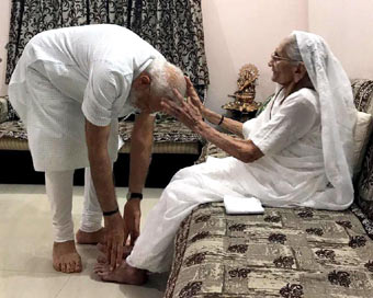 Gandhinagar: Prime Minister Narendra Modi meets his mother Heeraben Modi at her residence in Gandhinagar on May 26, 2019. (Photo: IANS/BJP)