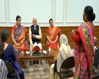 New Delhi: Prime Minister Narendra Modi interacts with Nari Shakti Awardees, in New Delhi on March 8, 2020. Also seen Union Women and Child Development Minister Smriti Irani. (Photo: IANS)
