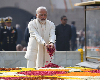 New Delhi: Prime Minister Narendra Modi pays tributes to Mahatma Gandhi on his death anniversary at Rajghat in New Delhi, on Jan 30, 2019. (Photo: IANS/PIB)