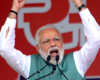 Patna: Prime Minister Narendra Modi waves to the crowd at 