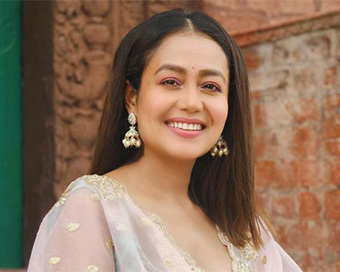 Neha Kakkar donates Rs 5 lakh to veteran lyricist Santosh Anand