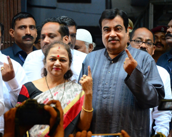 Nagpur: Union Minister and BJP leader Nitin Gadkari and his wife Kanchan Gadkari shows his forefinger marked with ink after casting his vote during Maharashtra assembly polls in Nagpur on Oct 21, 2019. (Photo: IANS)
