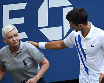 Djokovic disqualified after hitting line official with ball