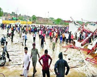 Barmer: People gathered at the site where a massive tent erected for people attending a religious gathering collapsed during a dust storm in Rajasthan