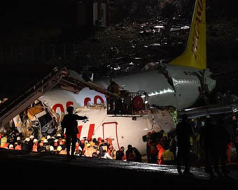 Plane slides off runway