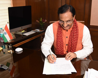 New Delhi: Ramesh Pokhriyal takes charge as the Union Minister for Human Resource Development, in New Delhi on May 31, 2019. (Photo: IANS/PIB)