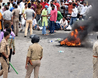 Varanasi: People burn tires as they stage a demonstration during a nationwide shutdown called by dozens of upper caste groups to protest against the amended SC/ST Act; in Varanasi.