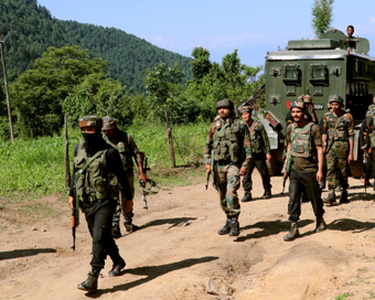 Pulwama: Security forces during a cordon and search operation after a militant was killed in a gunfight in Branpathri forest area of Tral in Jammu and Kashmir