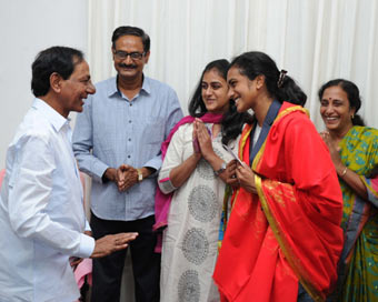 Indian badminton player P.V. Sindhu meets Telangana Chief Minister K Chandrasekhar Rao in Hyderabad on Aug 22, 2016. (Photo: IANS)